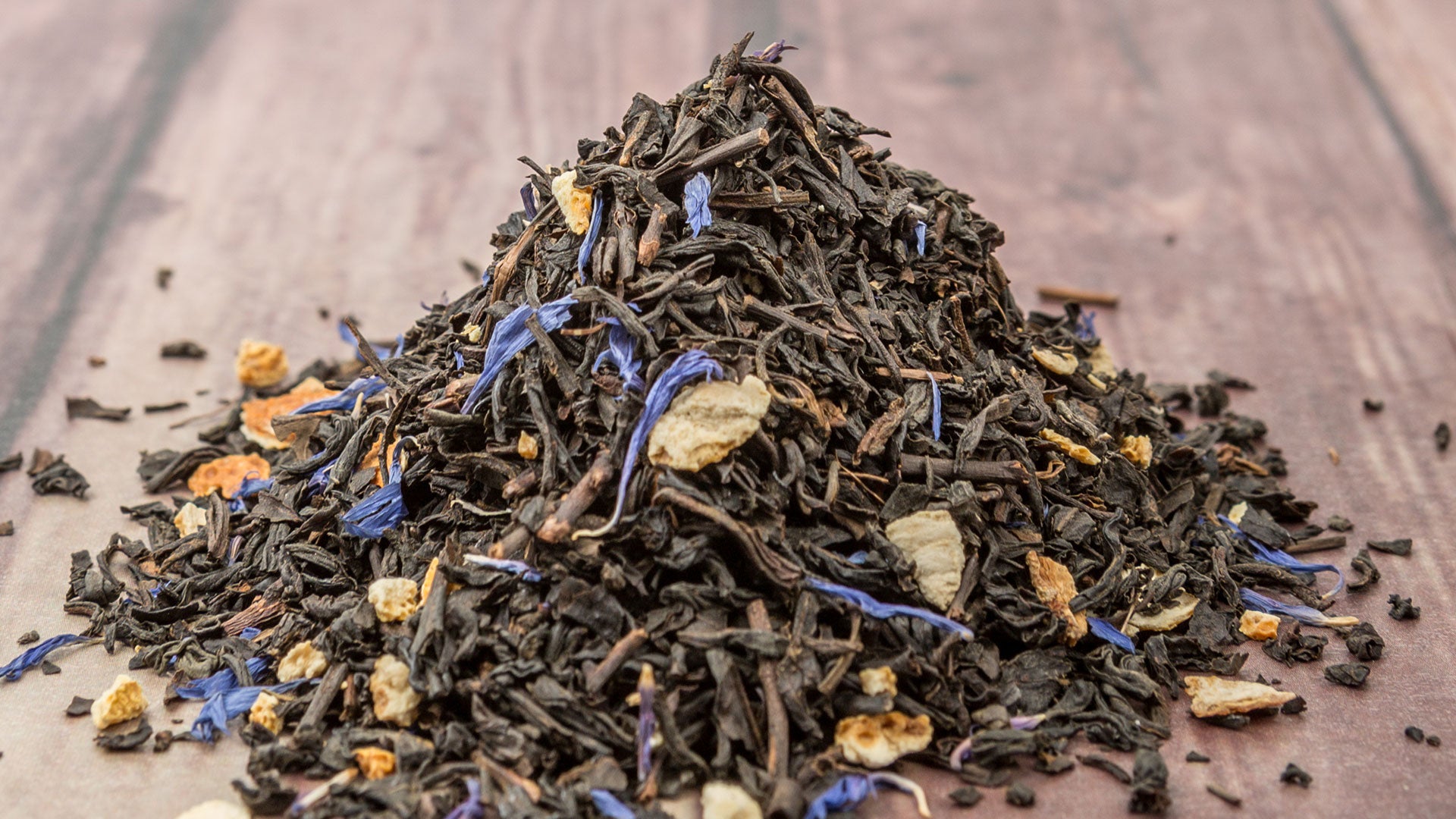 Loose-leaf Earl Grey tea with blue cornflower petals and orange peel